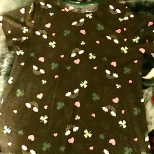 A shirt with clovers on it.